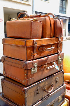 Paris, France, Europe.  The famous and worlds largest flea market - the St. Ouen "Marche des Puces.Stack of vintage leather suitcases