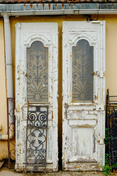 Paris, France, Europe.  The famous and worlds largest flea market - the St. Ouen "Marche des Puces.Old white doors for sale.