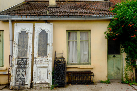 Paris, France, Europe.  The famous and worlds largest flea market - the St. Ouen "Marche des Puces.Old white doors for sale.