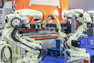 Controller of industrial robotic arm for performing, dispensing, material-handling and packaging...