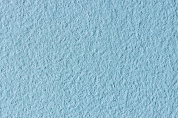 Light blue wall texture. Rough pastel surface. Light blue pastel texture. Wall texture
