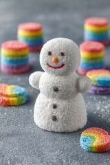 Fototapeta premium Sweet snowman surrounded by rainbow candies