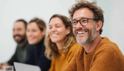 Laughing colleagues gathered around a laptop in a lively office meeting, sharing joy, camaraderie, and teamwork, with a professional yet cheerful vibe of collaboration and digital connection
