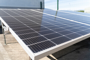 Solar panels are converting sunlight into renewable energy on a rooftop, providing sustainable power