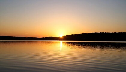 Obraz premium Tranquil lake at sunset offering a serene and minimalist aesthetic