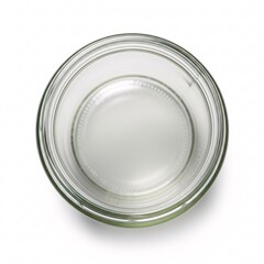An empty clear glass jar with screw threads, viewed from the top,