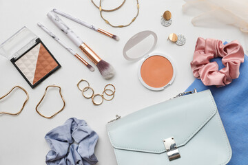 Composition with cosmetics, accessories, brushes and blush on white background. Closeup