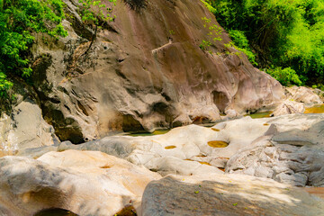 Stone blocks.

Mountain lakes and rivers of the Baho Falls near Nha Trang in Vietnam. During the rainy season, this place turns into a deep river with large waterfalls.