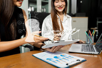 Businessman team hand Project manager working and update tasks and Gantt chart scheduling virtual diagram.with laptop in office.