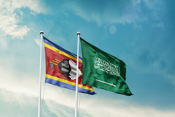 Eswatini Saudi Arabia friendship flags are waving in the sky. Two country flag for agreement or deal. Eswatini KSA national flag for commitment.
