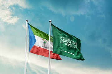 Equatorial Guinea Saudi Arabia friendship flags are waving in the sky. Two country flag for agreement or deal. Equatorial Guinea KSA national flag for commitment.