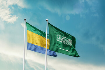Gabon Saudi Arabia friendship flags are waving in the sky. Two country flag for agreement or deal. Gabon KSA national flag for commitment.