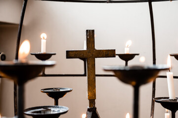 Serenity and reflection with candles and cross in peaceful setting