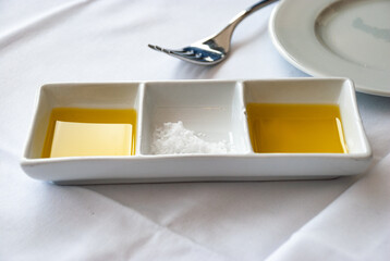 Gourmet dining experience with olive oil and sea salt arrangement