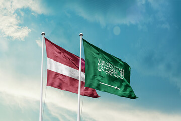 Latvia Saudi Arabia friendship flags are waving in the sky. Two country flag for agreement or deal....