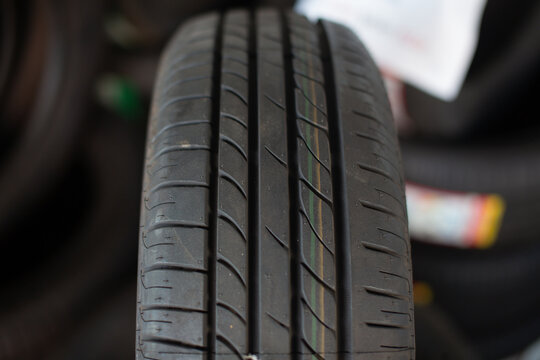 Close-up photo of car tire tread pattern with copy space