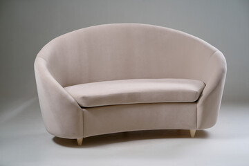 Elegant Modern Beige Sofa with Curved Design and Soft Upholstery