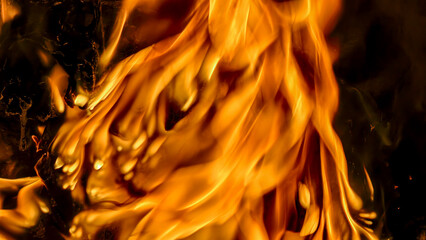Close-up view of vibrant flames dancing with intense heat and energy, creating a fiery spectacle.