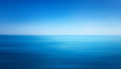Obraz premium a blurry blue background the sky and water with a gradient that transitions from light blue to dark blue