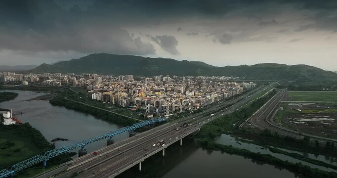 Aerial view of Navi Mumbai near Navi Mumbai International Airport, showing modern roads, scenic surroundings, and urban infrastructure. Ideal for smart city and development themes. 