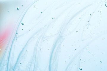 Light abstract swirls in blue liquid with soft color fade. Delicate flowing patterns in pale blue...
