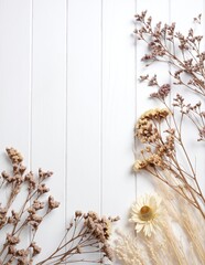A beautiful arrangement of dried flowers in soft pastel hues, elegantly scattered on a rustic white wooden background, creating a serene and natural aesthetic.