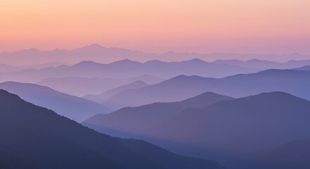 Obraz premium Colorful Mountain Range at Sunset with Pink Orange Sky and Layered Hills