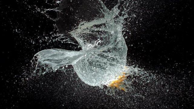 Sharp Knife Pierces And Slices Water Balloon In Slow Motion