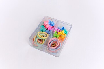 Colorful children's hair accessories on white background