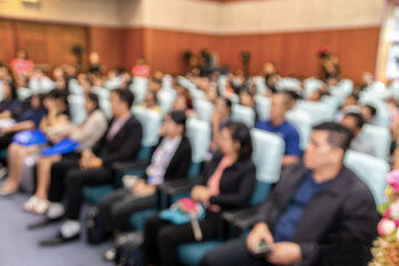 Abstract blurred photo of conference hall or seminar room with attendee background