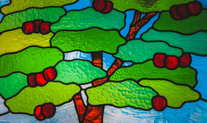 Orchard tree depicted in stained glass vitrail.