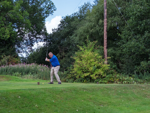 man driving off from tee