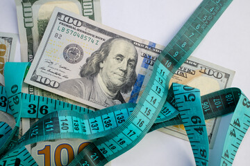 Basra, Iraq - August 5, 2025: A Measuring Tape and Money for Weight Loss and Healthcar