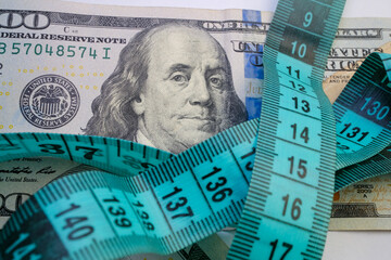 Basra, Iraq - August 5, 2025: A Measuring Tape and Money for Weight Loss and Healthcar