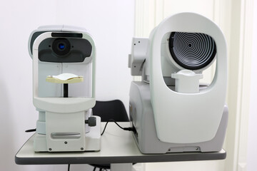 Ophthalmic diagnostic devices: non-contact tonometer and corneal topographer side by side. Used for...