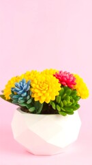 Fototapeta premium Vibrant Succulent Arrangement in Geometric Pot Against Pastel Pink