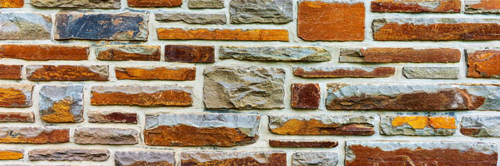 Panoramic image. Colorful stone wall useful for backgrounds