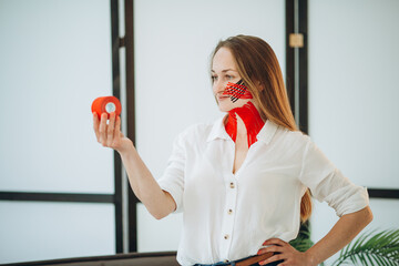 Physiotherapist holding kinesio tape roll for muscle therapy