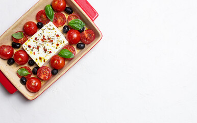 Baked feta cheese with tomatoes and olives. Healthy food. Vegetarian food.