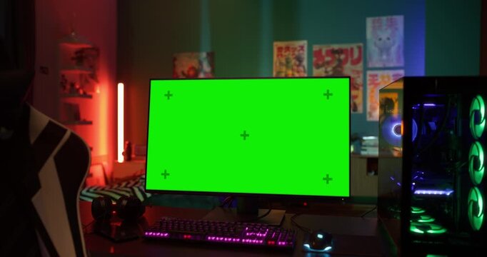 Static Footage with a Gaming Personal Computer with a Green Screen Mock Up Template Standing on a Table in a Stylish Neon-Lit Room. No People in the Shot, Software Developer Nowhere to Be Seen