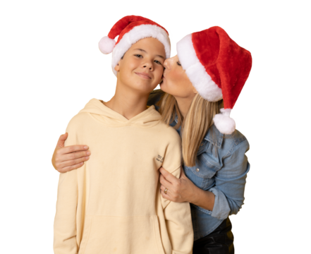 Pretty young mom and her handsome child son together wearing Santa hats over transparent background. PNG. - Powered by Adobe