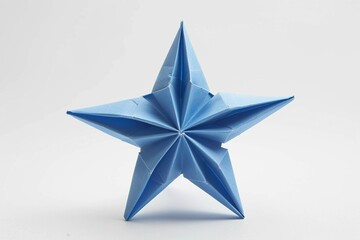 Fototapeta premium Blue origami star with intricate folds on a minimalist background