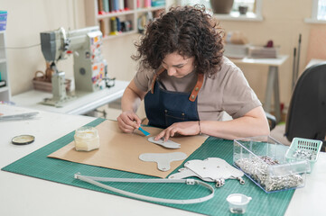 Woman tanner at work in the workshop. 