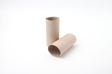 Empty cardboard tubes from toilet rolls on white, ideal for eco projects, sustainable packaging, upcycling campaigns, zero waste marketing, creative crafting and handmade product