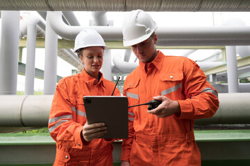Petroleum Refinery. Oil refinery. Gas pipeline network system. Petrochemical engineer working,...