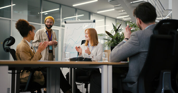 Bearded Arab man holds presentation at whiteboard in office