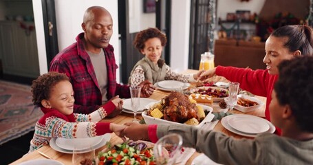 Happy family, christmas or praying with food at dining table for spiritual connection in home. Parents, children or holding hands in gratitude for holy faith, christianity or festive dinner together - Powered by Adobe