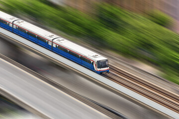 Top view of the fast sky train moving forward in morning time and rush hours, Bangkok, Thailand.
