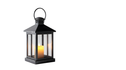 Black metal lantern with candle glowing inside, isolated on white