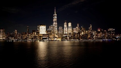 Night New York Skyline In Manhattan New York United States. Aerial View Of A High-Rise Buildings And Traffic Showcasing Urban Life. Building Town Sky Background Illuminated Urban.